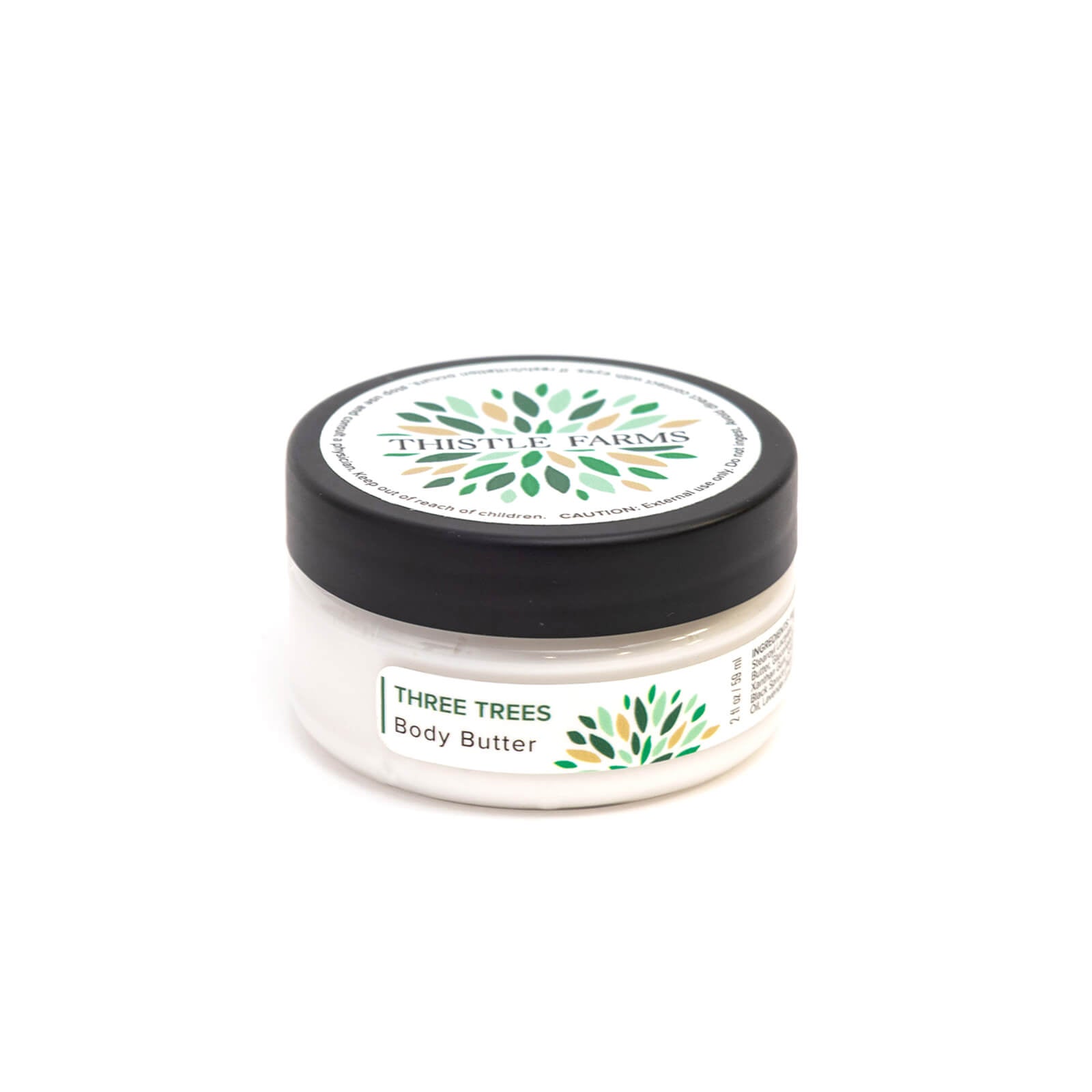 Jar of Three Trees Body Butter from Thistle Farms on a white background