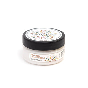 Jar of Thistle Farms Frosted Gingerbread Body Butter on a white background
