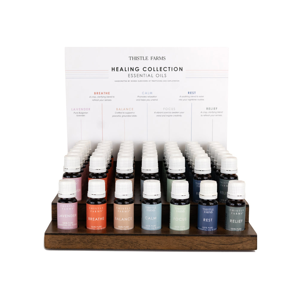 Display of Thistle Farms Healing Collection essential oils with a white background